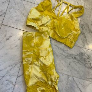 Yellow tie dye biker shorts and sports bra